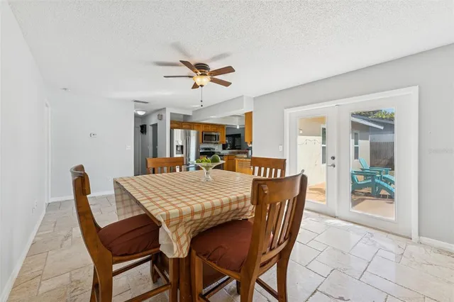 a dining room with furniture and window