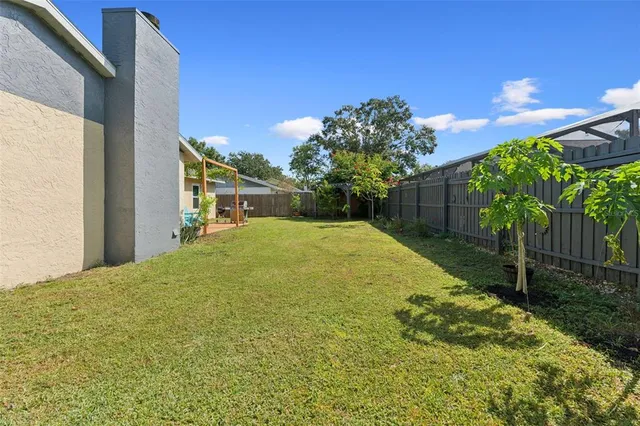 a view of a yard with an outdoor space
