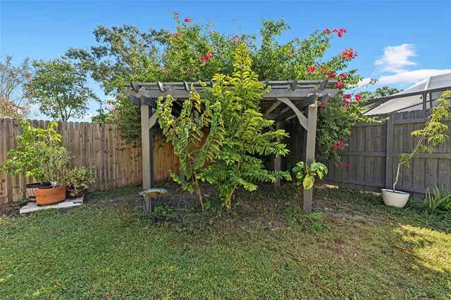 a backyard of a house with lots of green space