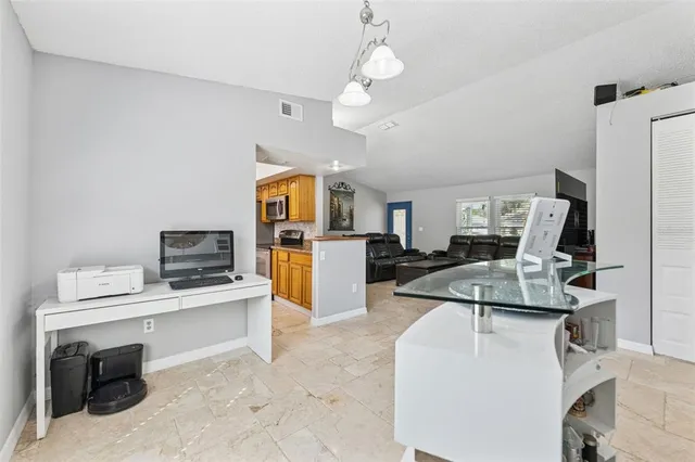 a living room with furniture and flat screen tv