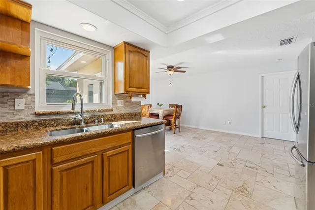 a kitchen with a sink and a window