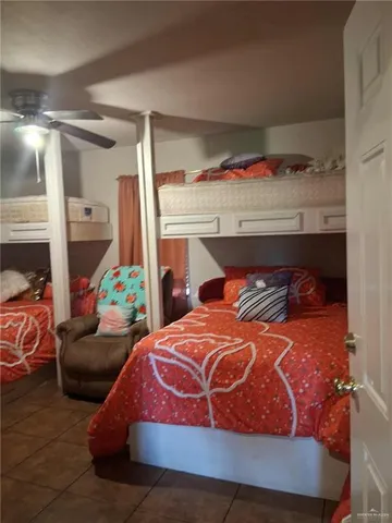 a bedroom with bed and balcony