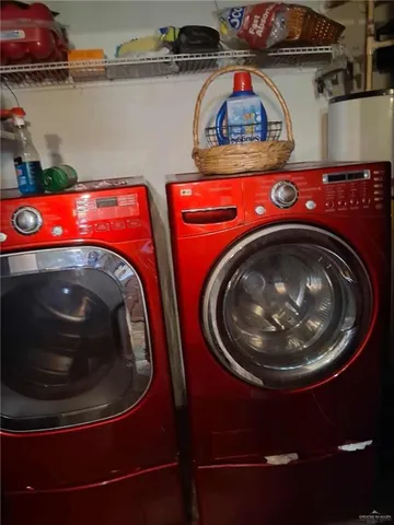 a utility room with stainless steel appliances and lots of appliances