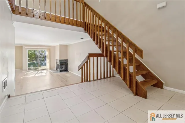 a view of an entryway with wooden floor