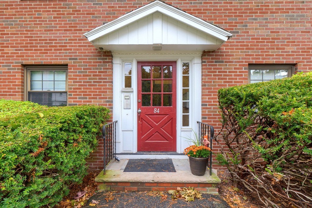 84 Renwick Road, Unit C Wakefield, MA 01880 - Photo 1 of 29 a front view of a house with garden