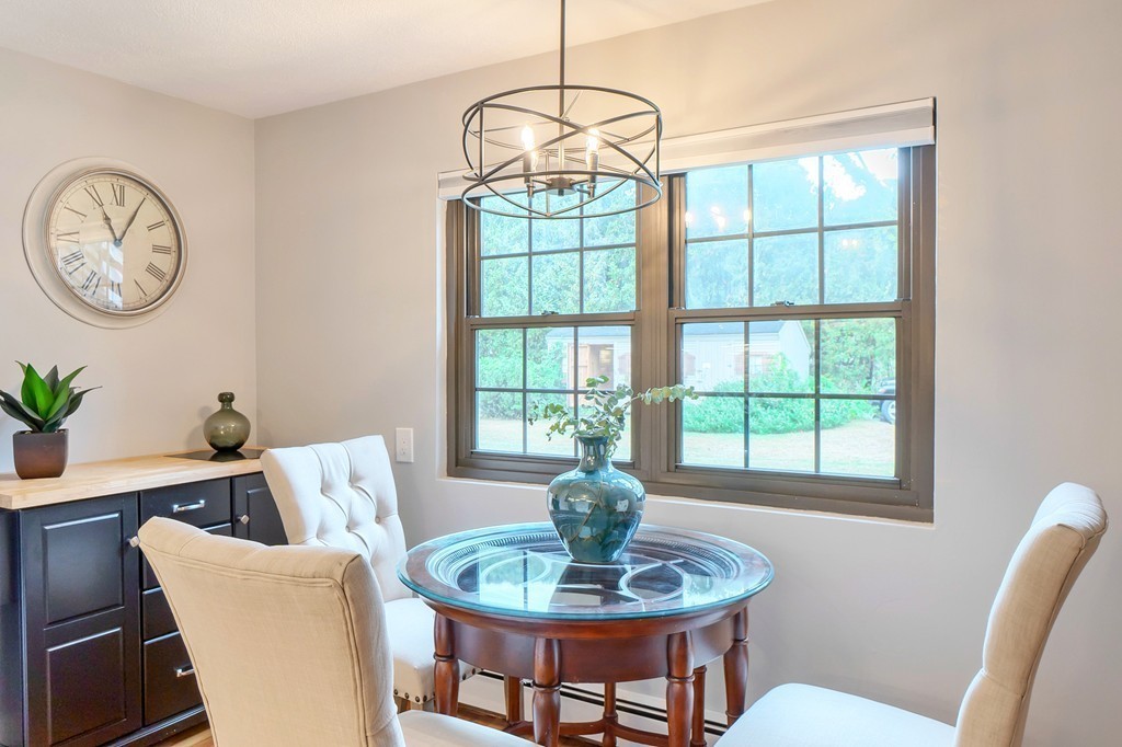 84 Renwick Road, Unit C Wakefield, MA 01880 - Photo 13 of 29 a dining room with furniture a rug and a window
