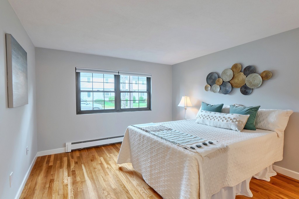 84 Renwick Road, Unit C Wakefield, MA 01880 - Photo 18 of 29 a bedroom with a bed and a window