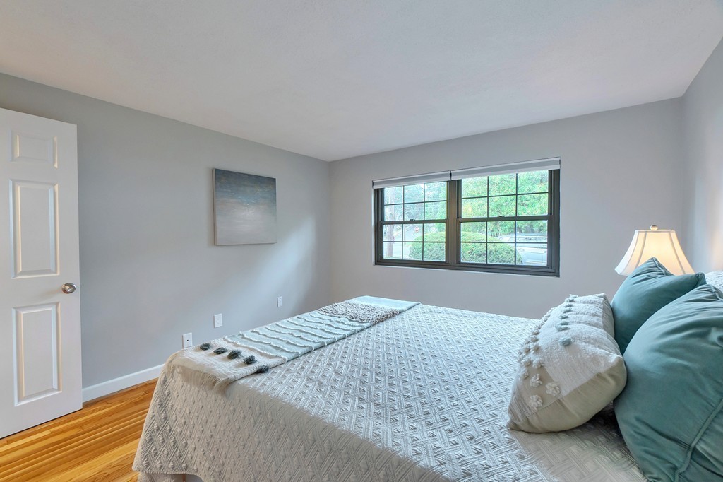 84 Renwick Road, Unit C Wakefield, MA 01880 - Photo 20 of 29 a bedroom with a bed and a window