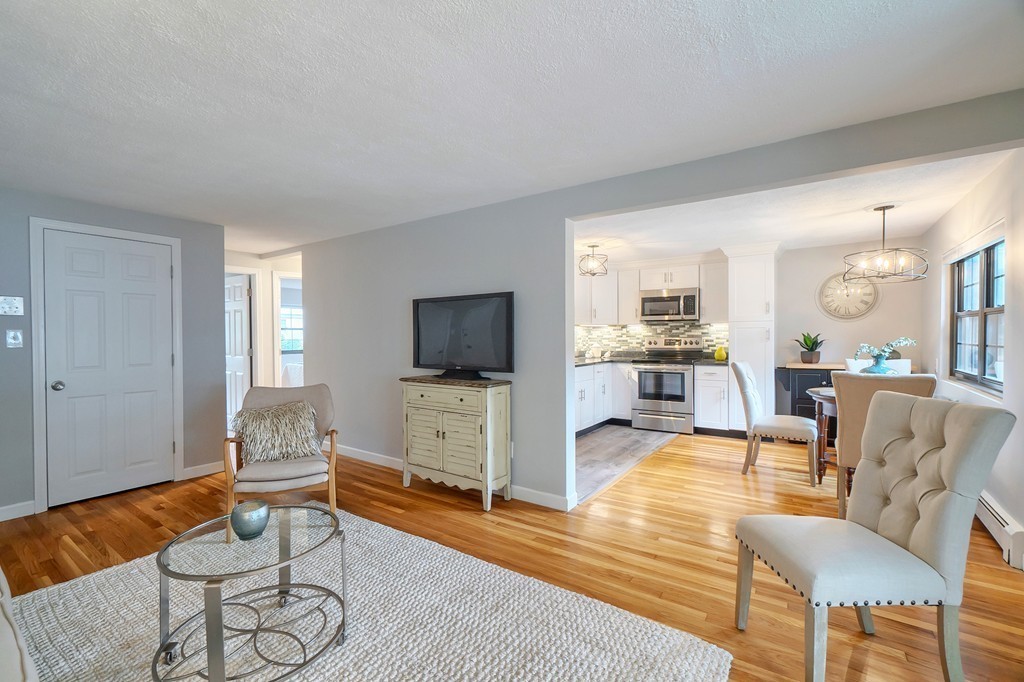 84 Renwick Road, Unit C Wakefield, MA 01880 - Photo 6 of 29 a living room with furniture and a flat screen tv