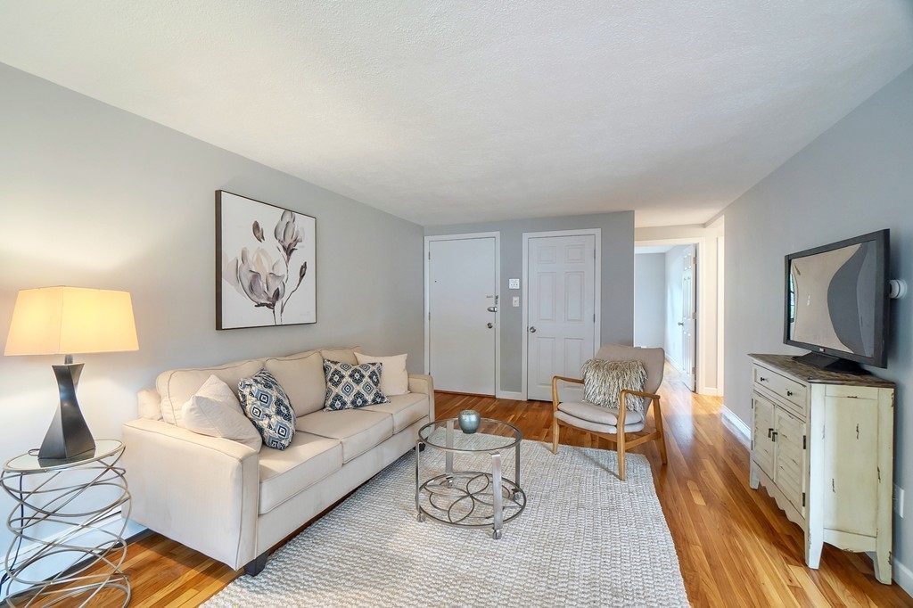 84 Renwick Road, Unit C Wakefield, MA 01880 - Photo 7 of 29 a living room with furniture and a flat screen tv