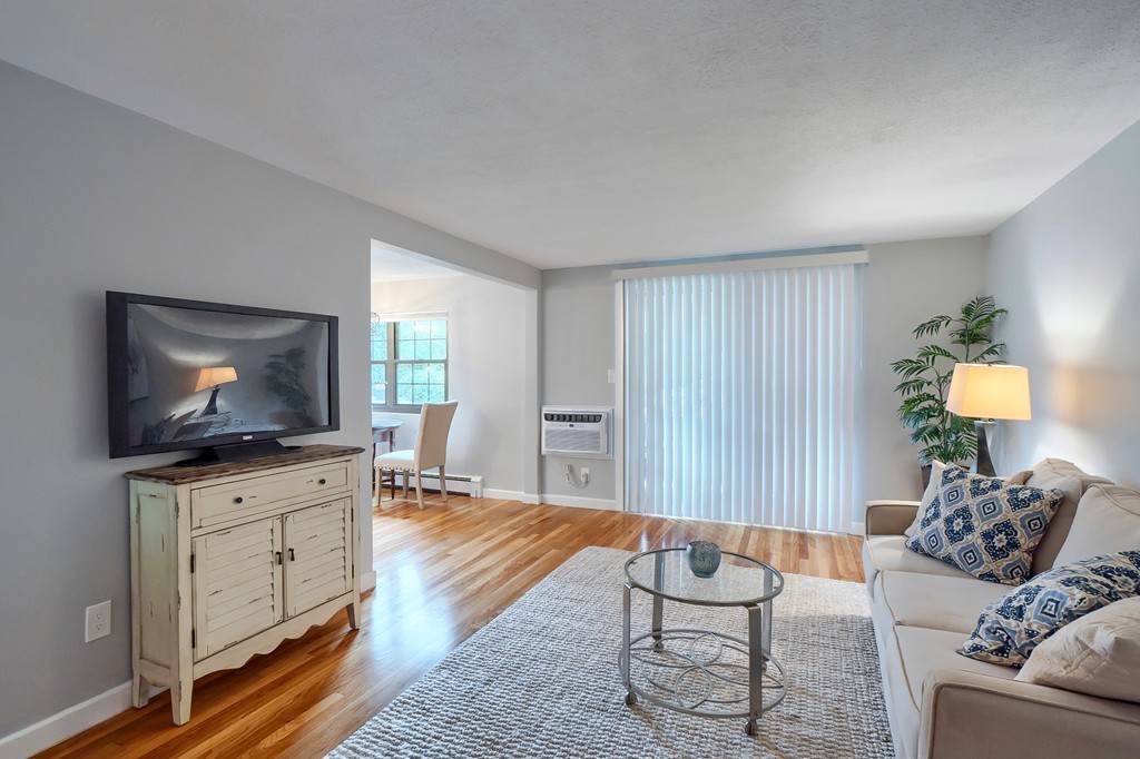 84 Renwick Road, Unit C Wakefield, MA 01880 - Photo 8 of 29 a living room with furniture and a flat screen tv