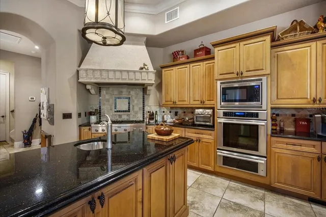 a bedroom with furniture and a large window