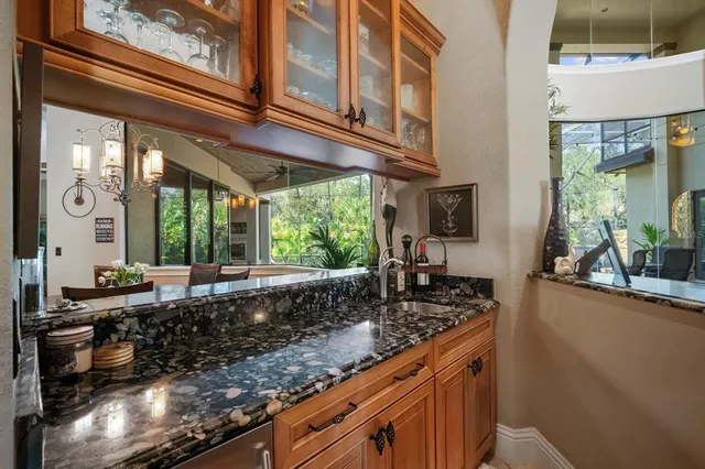 a bedroom with furniture and a large window