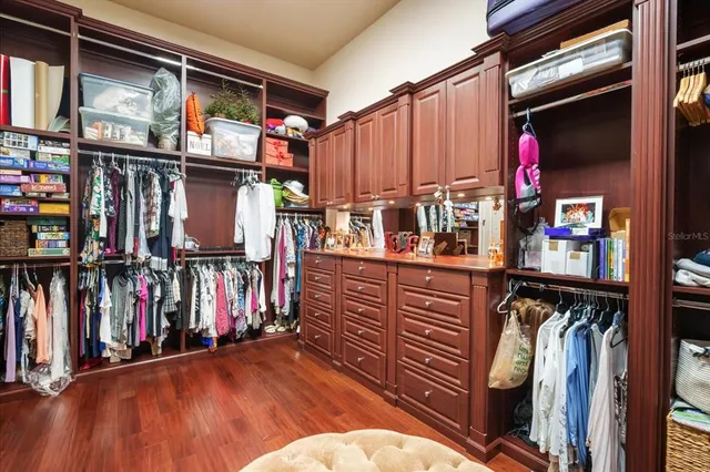 a bathroom with a sink a vanity and a mirror
