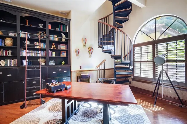 a view of a balcony with furniture and a floor to ceiling window