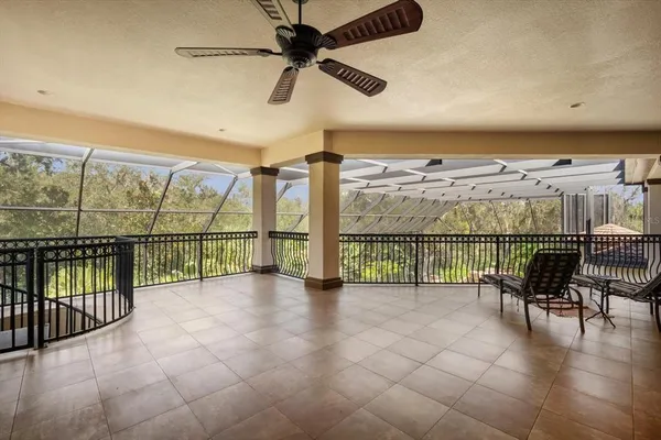 a view of balcony with wooden floor and fence