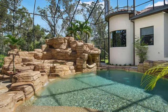 a view of balcony with wooden floor and fence