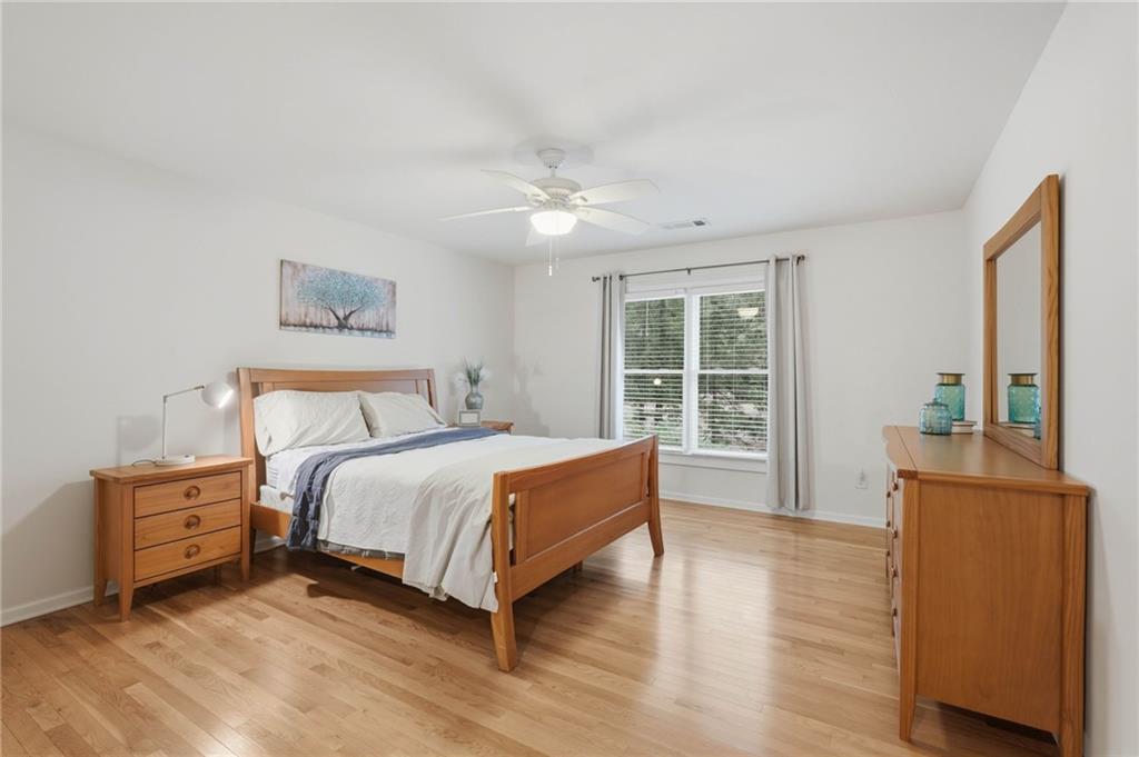 4891 Bill Cheek Road Auburn, GA 30011 - Photo 42 of 99 a bed room with a bed and a window