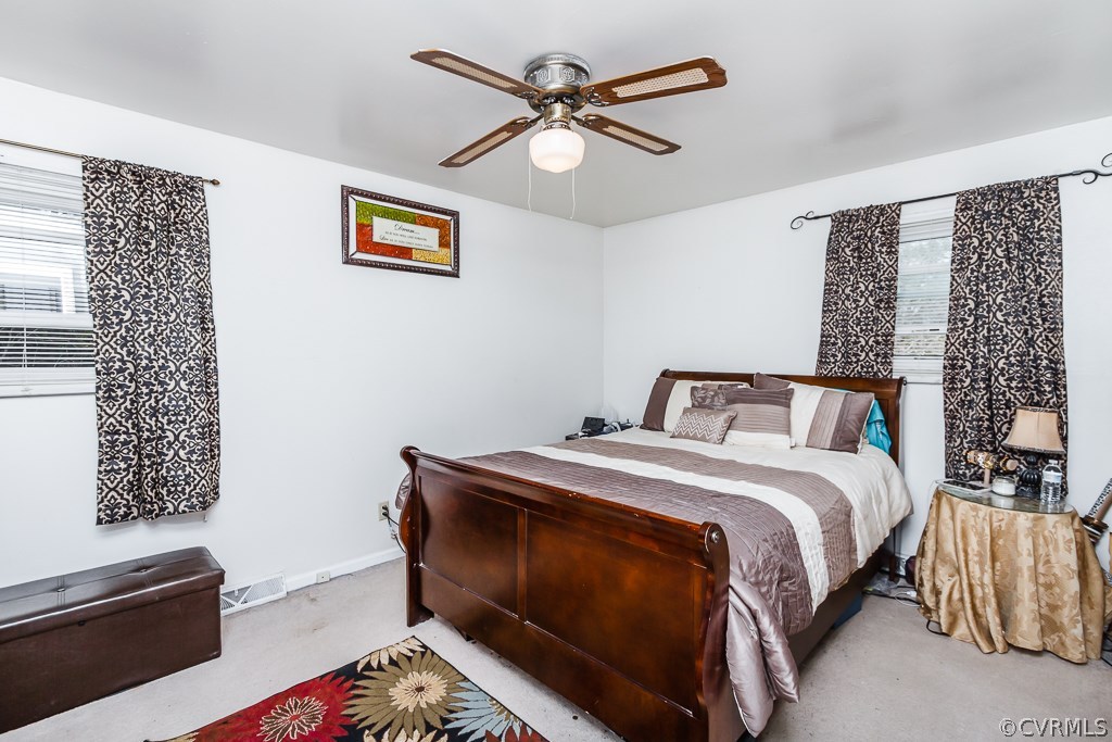 6332 Barrister Road Chesterfield, VA 23832 - Photo 15 of 24 a bedroom with a bed and a chandelier