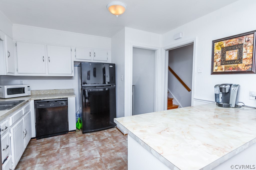6332 Barrister Road Chesterfield, VA 23832 - Photo 6 of 24 a kitchen with granite countertop a refrigerator and a stove top oven
