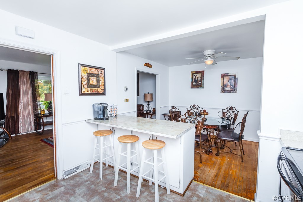 6332 Barrister Road Chesterfield, VA 23832 - Photo 8 of 24 a view of a dining room with furniture and wooden floor