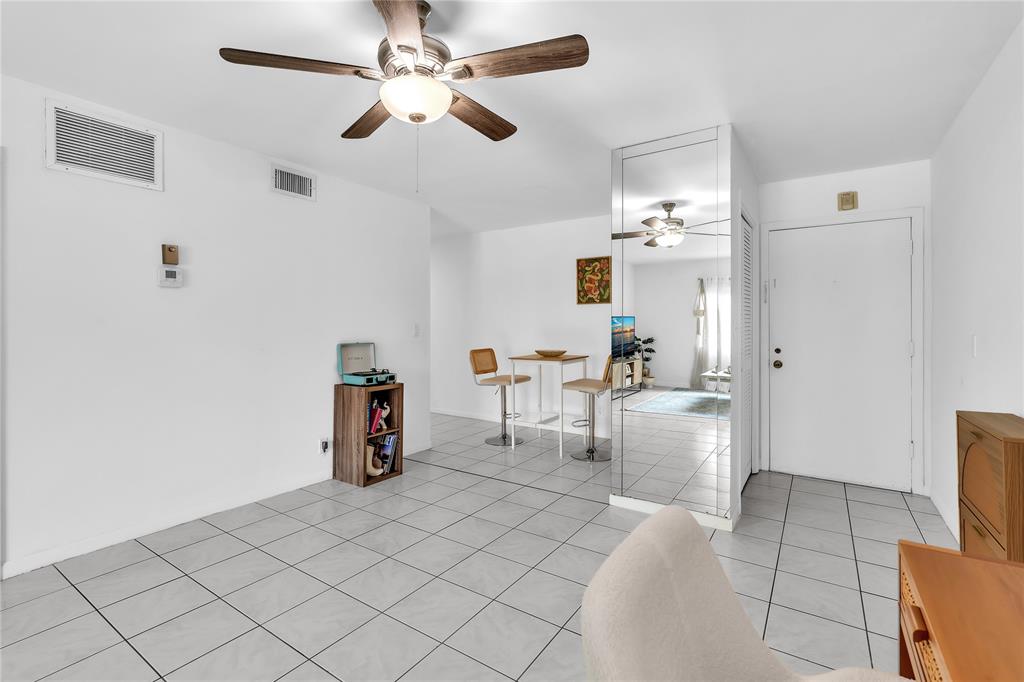 1950 North Andrews Avenue, Unit 210D Wilton Manors, FL 33305 - Photo 13 of 52 a view of kitchen and living room