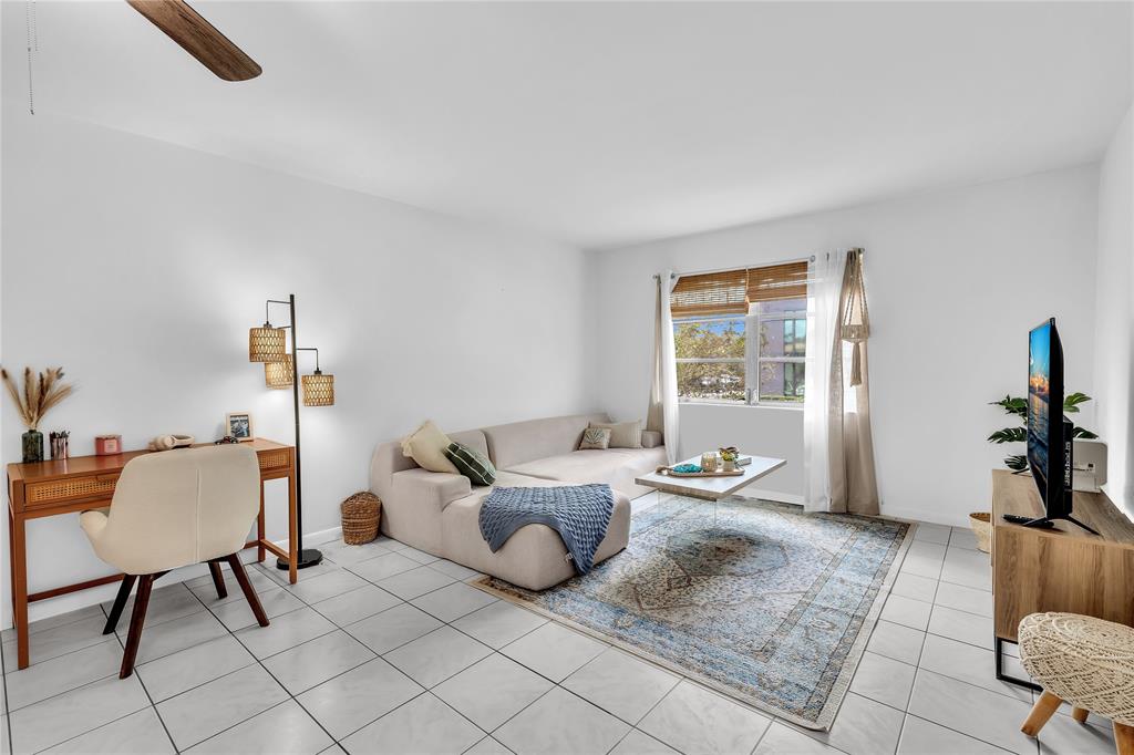 1950 North Andrews Avenue, Unit 210D Wilton Manors, FL 33305 - Photo 16 of 52 a bedroom with furniture and a window