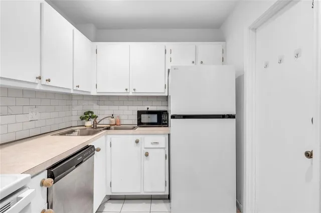 a bathroom with a double vanity sink and mirror