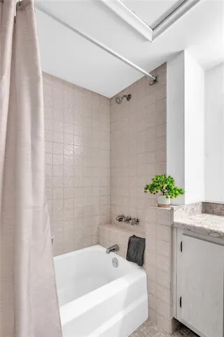 an aerial view of residential houses with outdoor space and street view