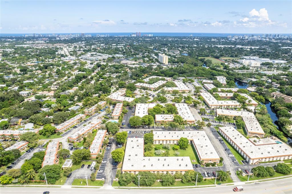 1950 North Andrews Avenue, Unit 210D Wilton Manors, FL 33305 - Photo 42 of 52 an aerial view of residential houses with outdoor space and trees