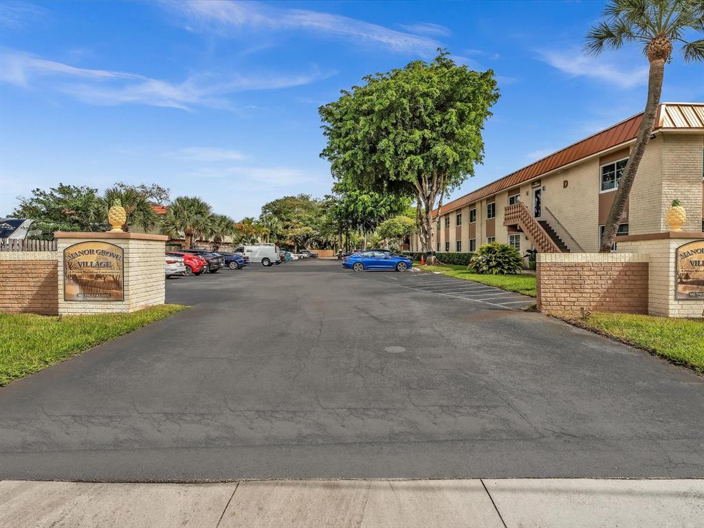1950 North Andrews Avenue, Unit 210D Wilton Manors, FL 33305 - Photo 45 of 52 a view of street with parked cars