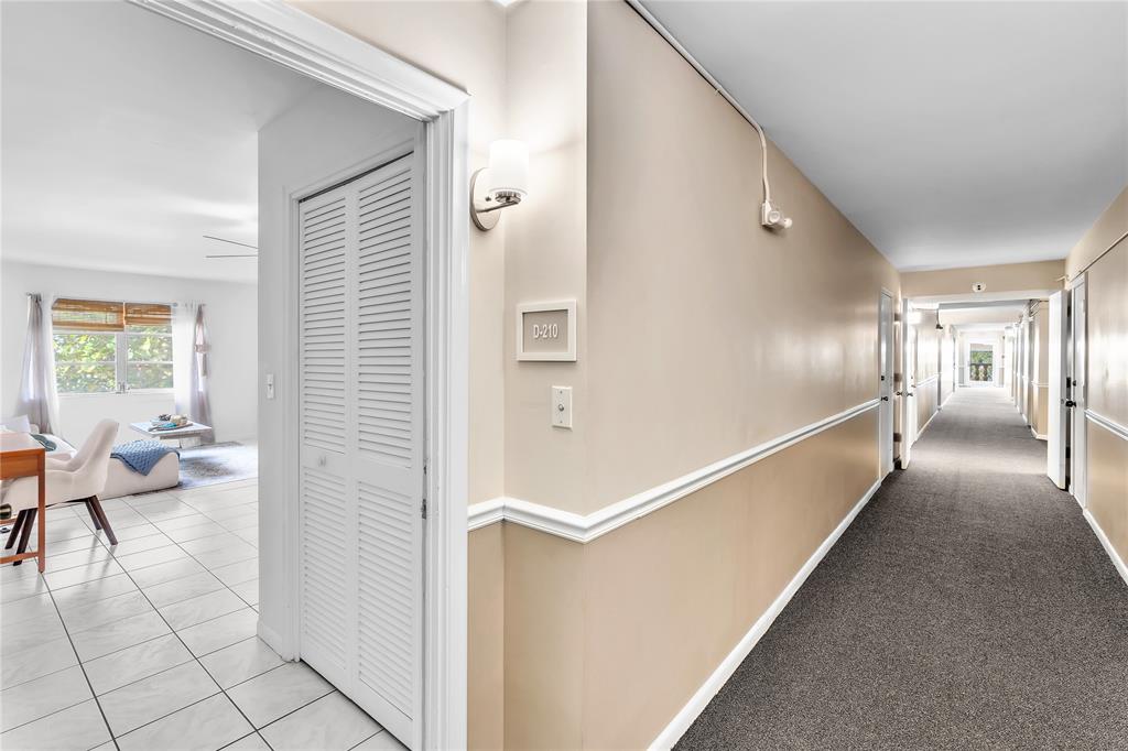 1950 North Andrews Avenue, Unit 210D Wilton Manors, FL 33305 - Photo 7 of 52 a view of a hallway with living room and furniture