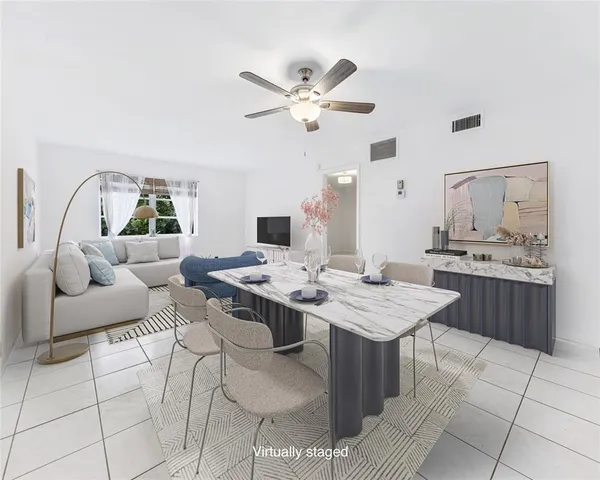 a living room with furniture and white walls