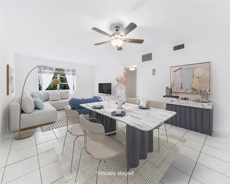 1950 North Andrews Avenue, Unit 210D Wilton Manors, FL 33305 - Photo 8 of 52 a view of a kitchen with a dining table and chairs