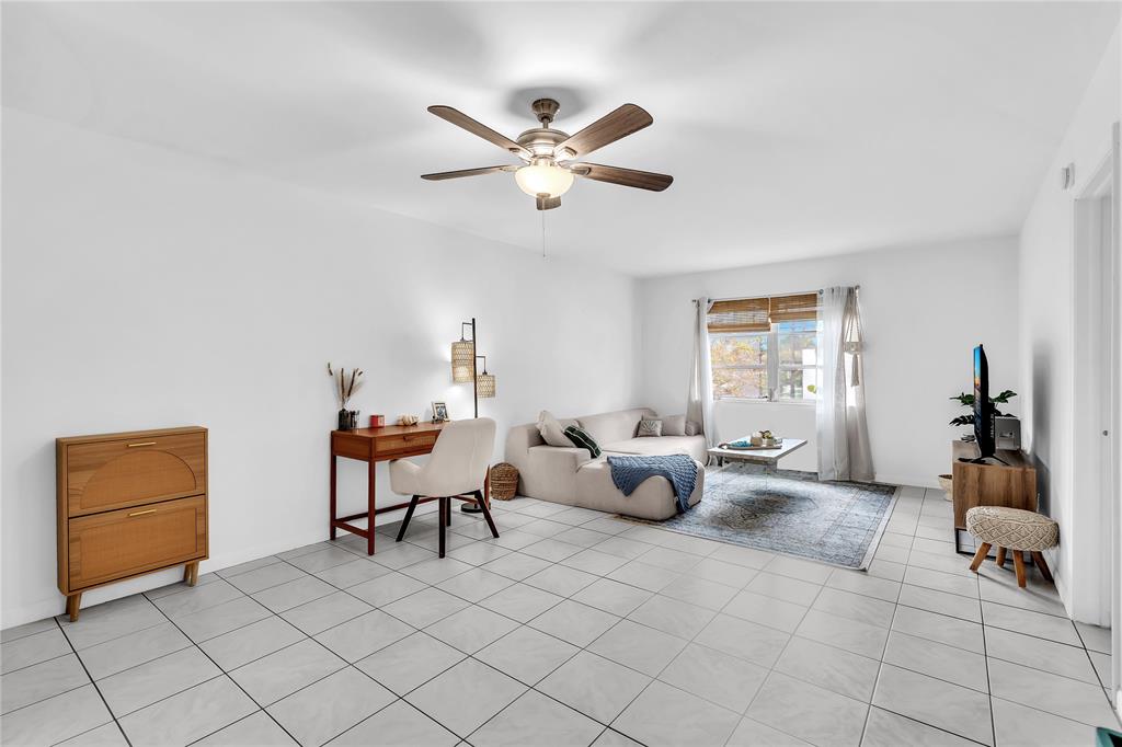 1950 North Andrews Avenue, Unit 210D Wilton Manors, FL 33305 - Photo 9 of 52 a living room with furniture and white walls