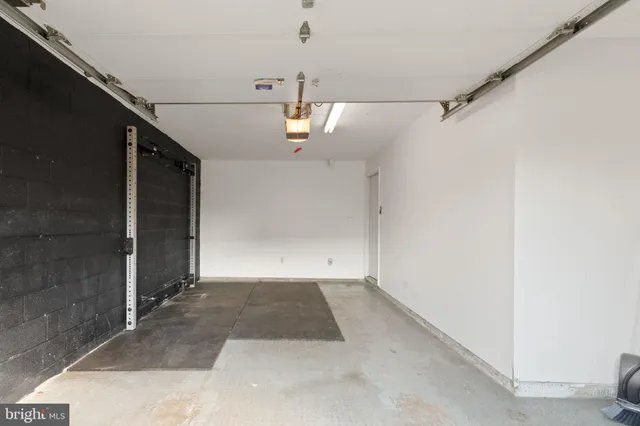 a view of a room with a ceiling fan