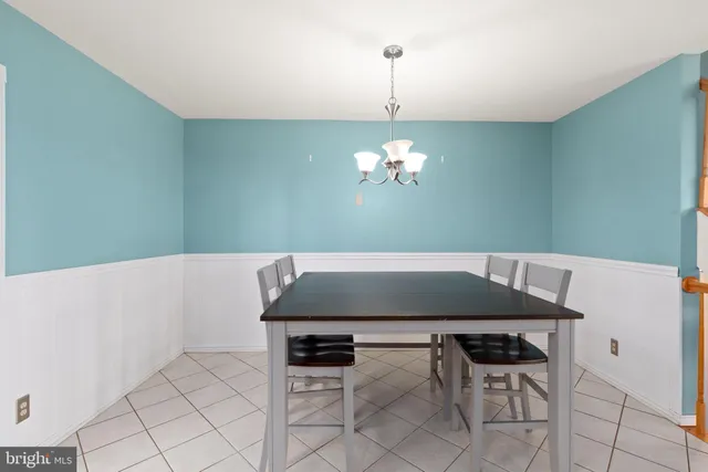 a view of a dining room and chandelier fan