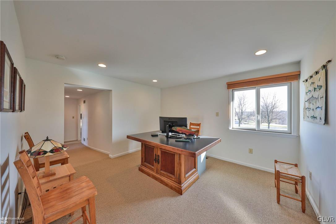 667 Bower Road Nazareth, PA 18064 - Photo 21 of 40 a living room with furniture a flat screen tv and a window