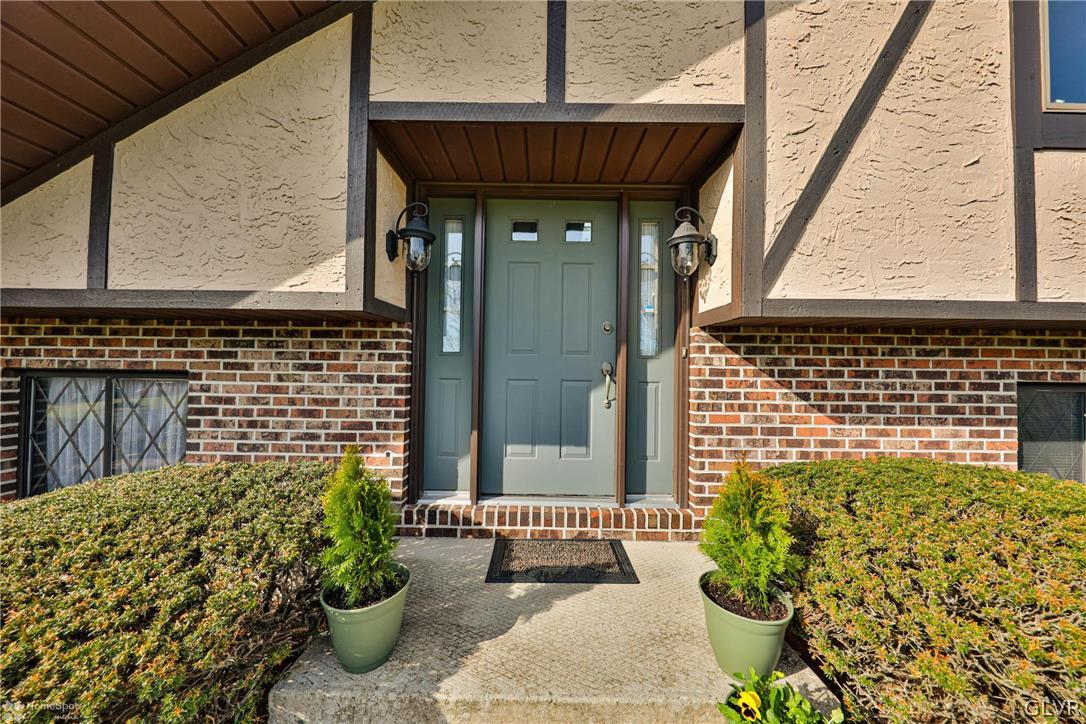 667 Bower Road Nazareth, PA 18064 - Photo 4 of 40 a front view of a house with a garden