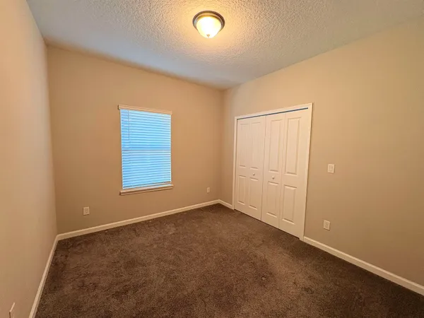 an empty room with a empty space and a window