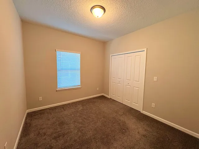 an empty room with a empty space and a window