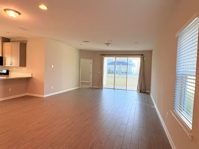 a view of a kitchen with a sink and a stove top oven