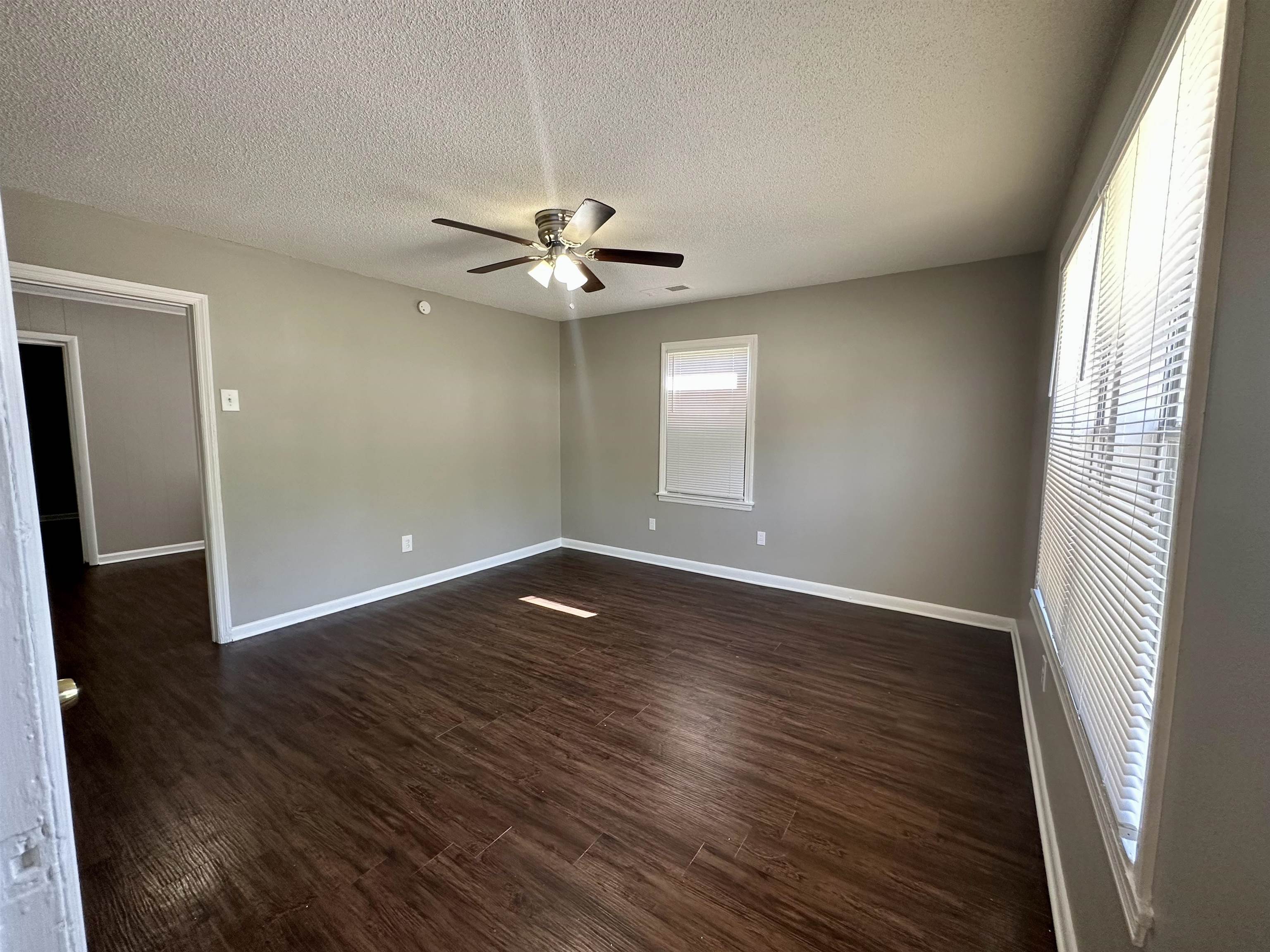296 Glencoe Road Memphis, TN 38109 - Photo 17 of 18 an empty room with wooden floor and window