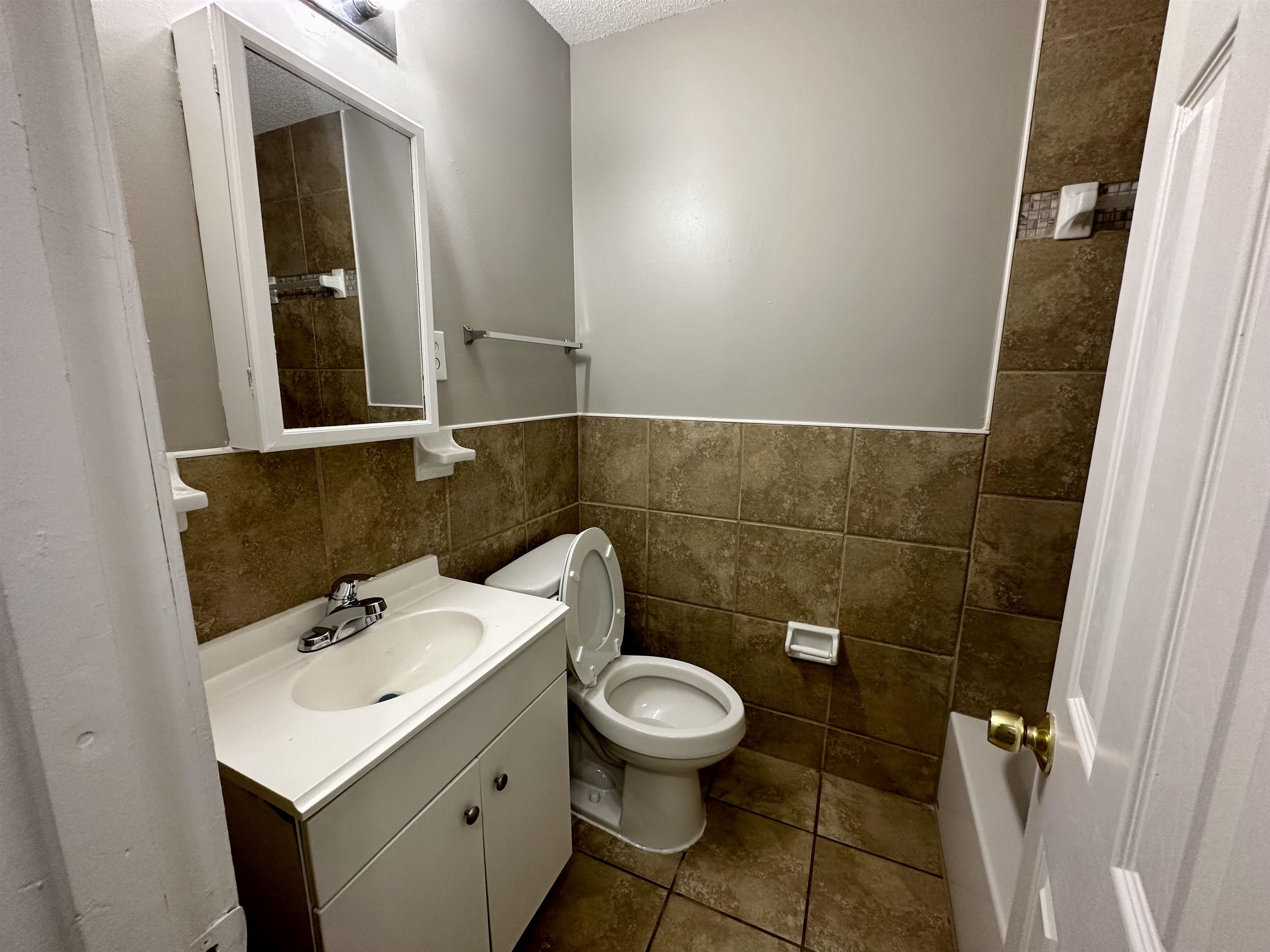 296 Glencoe Road Memphis, TN 38109 - Photo 8 of 18 a bathroom with a sink and a toilet