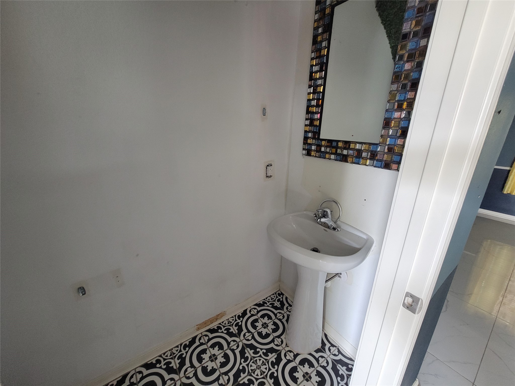 6030 Horizon Sky Road Cove, TX 77523 - Photo 11 of 12 a bathroom with a sink and a mirror