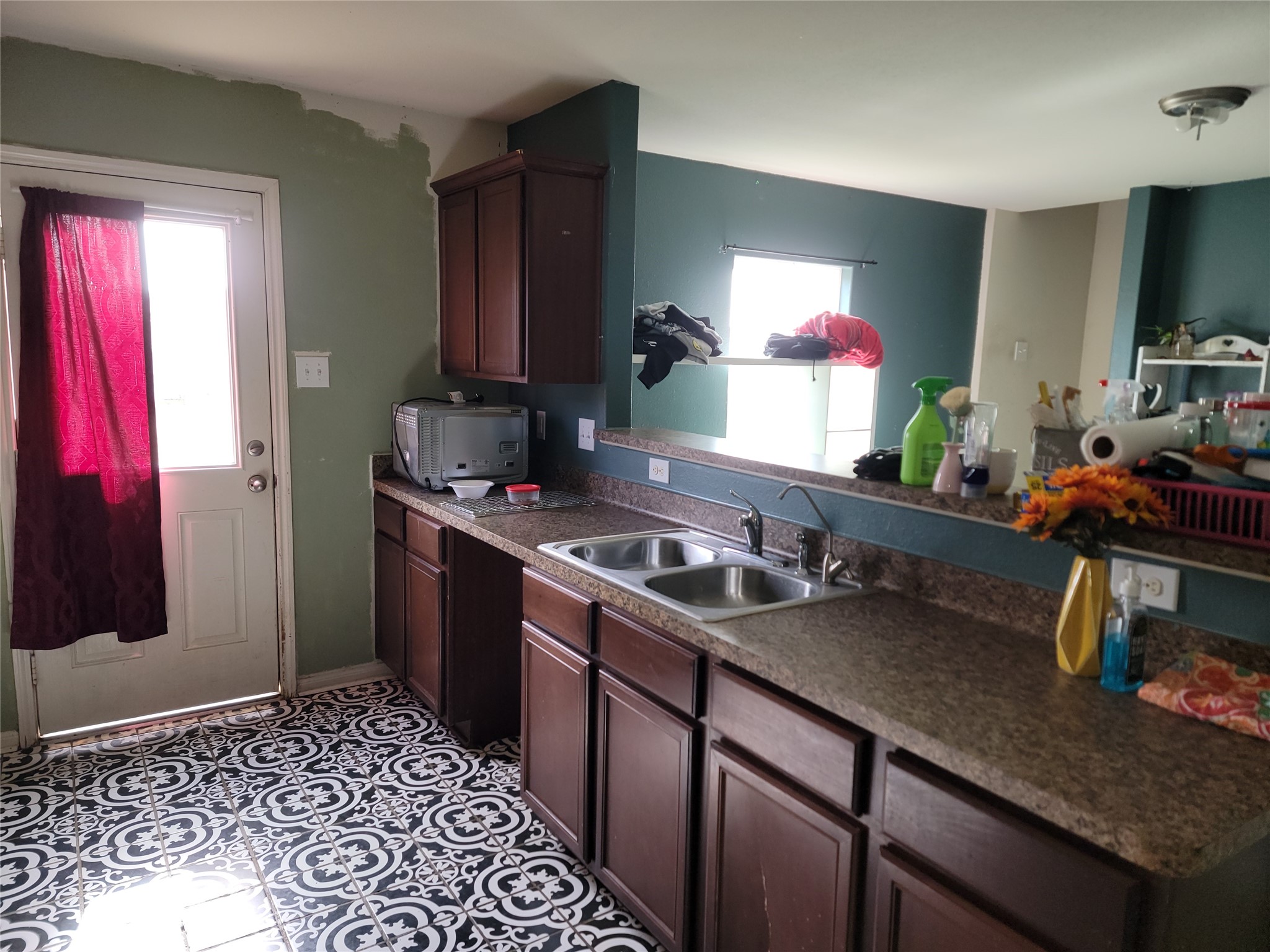 6030 Horizon Sky Road Cove, TX 77523 - Photo 2 of 12 a kitchen with a sink stove and cabinets