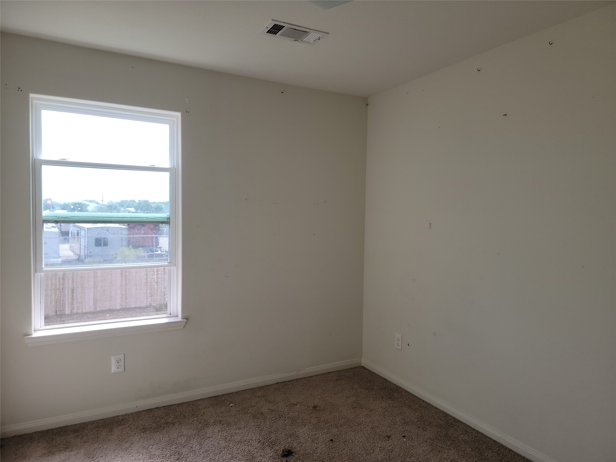 6030 Horizon Sky Road Cove, TX 77523 - Photo 6 of 12 an empty room with a window