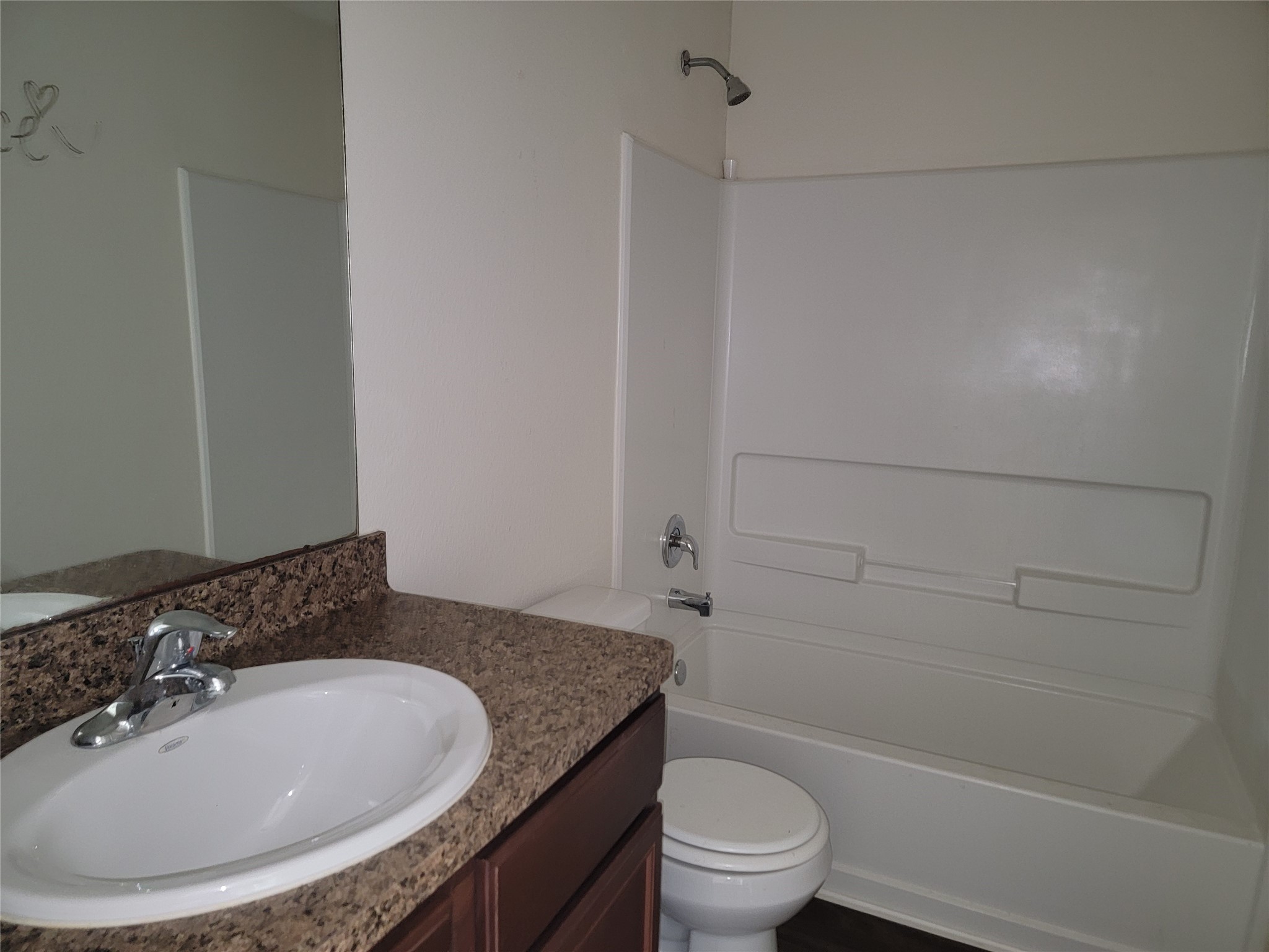 6030 Horizon Sky Road Cove, TX 77523 - Photo 9 of 12 a bathroom with a granite countertop sink toilet and shower