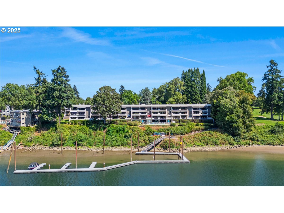 790 Southeast Webber Street, Unit 305 Portland, OR 97202 - Photo 2 of 30 a view of swimming pool with an outdoor space and seating area