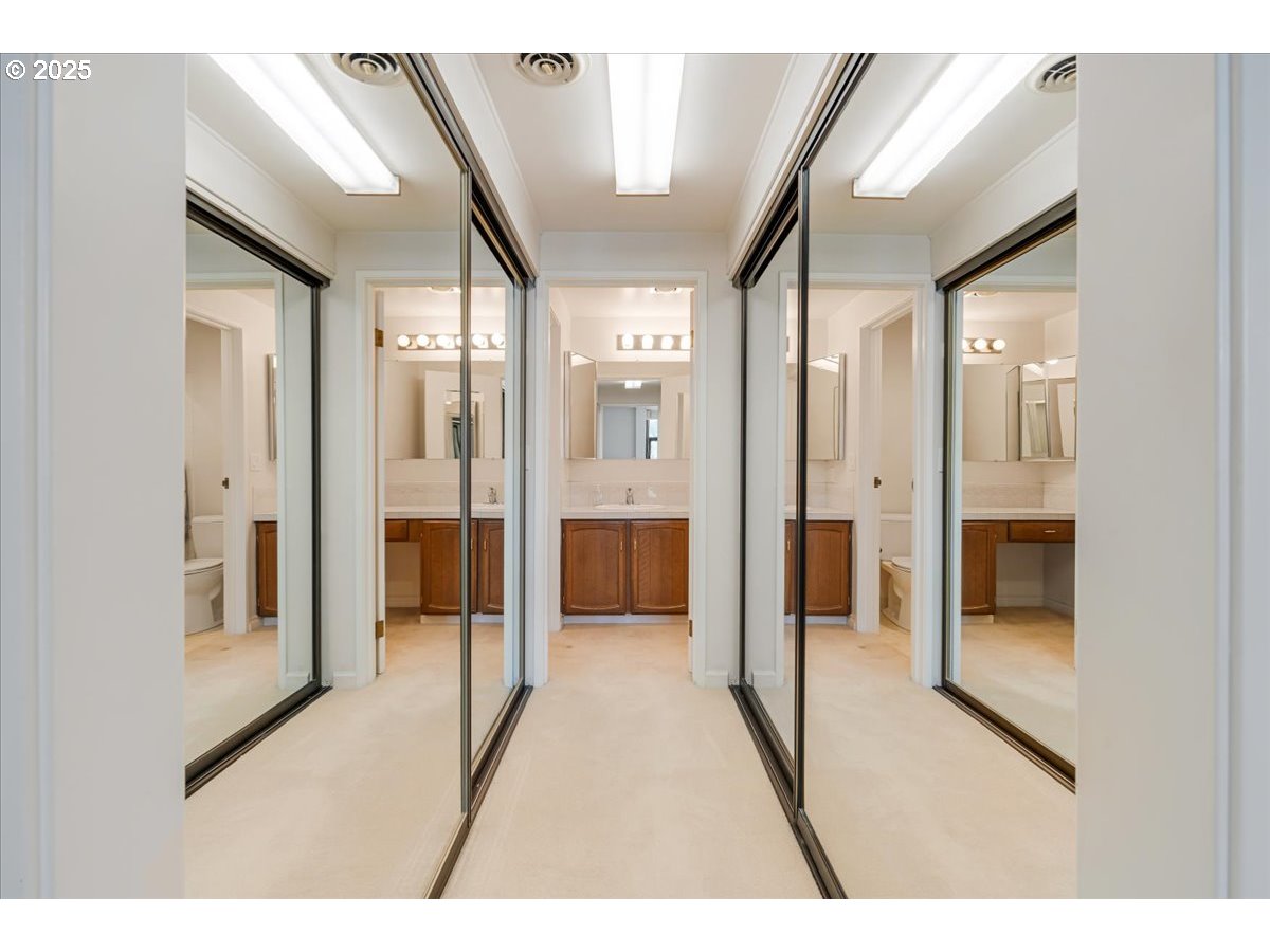 790 Southeast Webber Street, Unit 305 Portland, OR 97202 - Photo 22 of 30 a bathroom with a glass shower door and a mirror